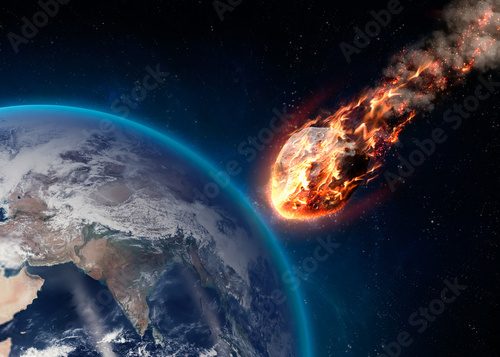 Fototapeta Meteor glowing as it enters the Earth's atmosphere
