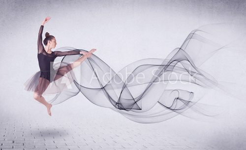 Fototapeta Modern ballet dancer performing with abstract swirl