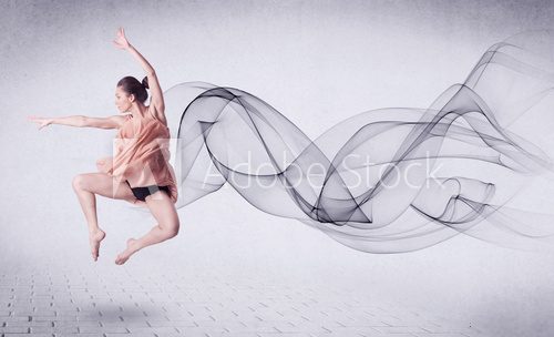 Fototapeta Modern ballet dancer performing with abstract swirl