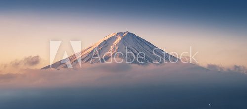 Fototapeta Mount Fuji enshrouded in clouds with clear sky from lake kawaguchi, Yamanashi, Japan