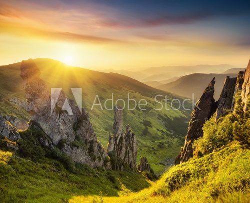 Fototapeta Mountain valley during sunrise. Natural summer landscape