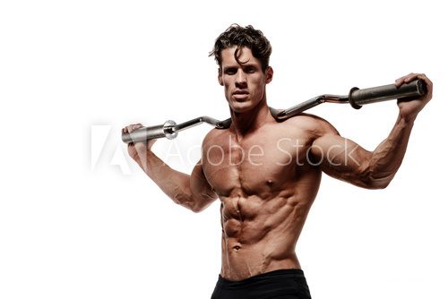 Fototapeta Muscular bodybuilder man doing exercises