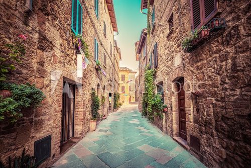 Fototapeta Narrow street in an old Italian town of Pienza. Tuscany, Italy. Vintage