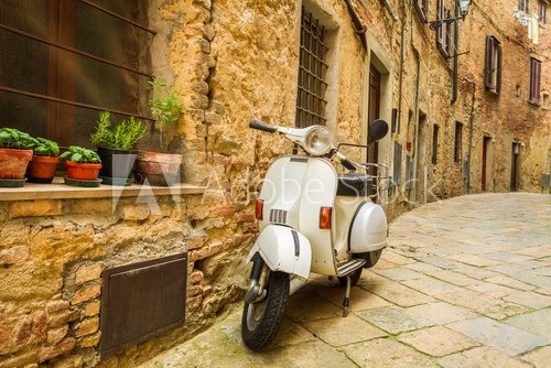 Fototapeta Old Vespa scooter on the street in Italy