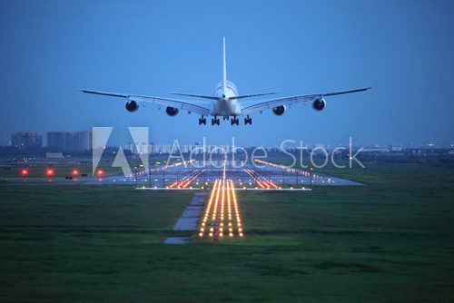 Fototapeta passenger plane fly up over take-off runway from airport