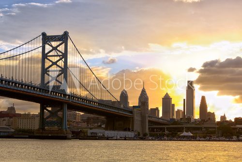 Fototapeta Philadelphia skyline and Ben Franklin Bridge at sunset, United States