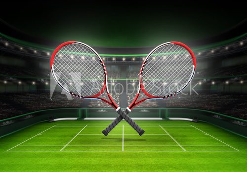 Fototapeta red and white tennis rackets placed over a grass court