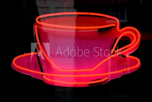 Fototapeta Red neon lighting equipment in shape of cup for coffee
