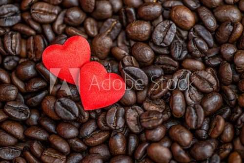 Fototapeta Red satin hearts on coffee beans, valentines or mothers day background, love celebrate