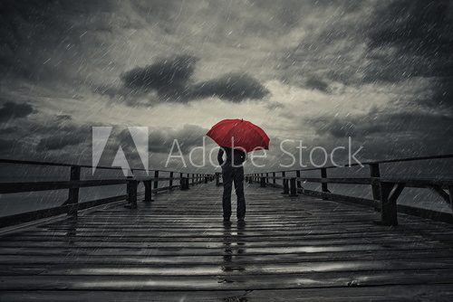 Fototapeta Red umbrella in storm