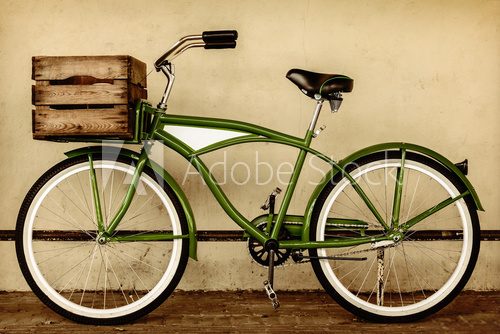 Fototapeta Retro styled sepia image of a vintage bicycle with wooden crate