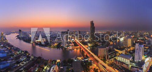 Fototapeta River in Bangkok city with high office building in night time