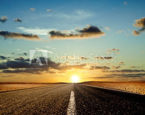 Fototapeta Road ahead and the sunset