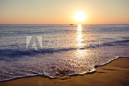 Fototapeta Sandy beach at sunset