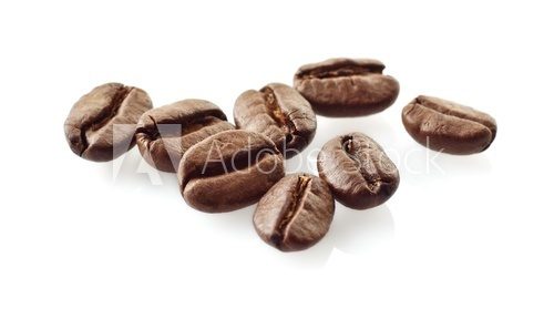 Fototapeta Scattered coffee beans on white