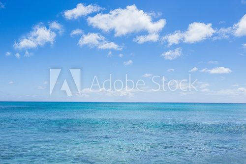 Fototapeta seascape with clouds and blue sky background
