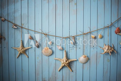 Fototapeta Seashells on blue boards vacation holiday