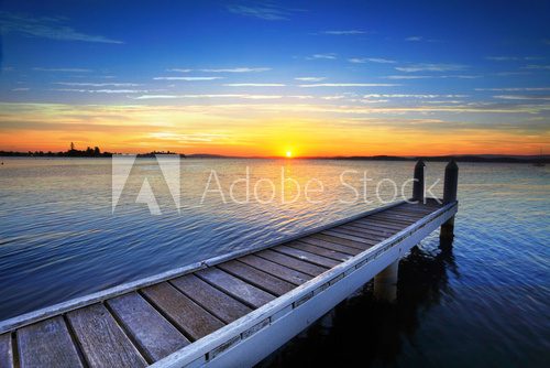 Fototapeta Setting sun behind the boat jetty, Lake Maquarie