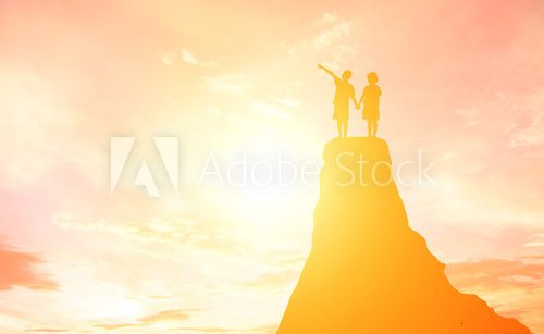 Fototapeta Silhouette boy and girl pointing to the future.