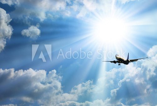 Fototapeta Silhouette of airplane with a beautiful sky