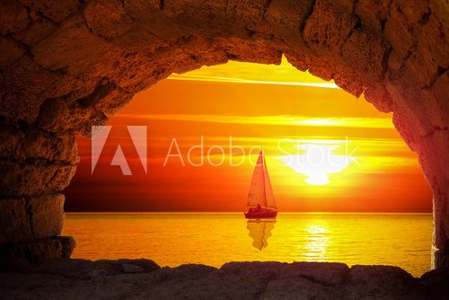 Fototapeta Silhouette of boat at sunset