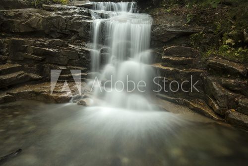 Fototapeta Silky water of Stairs Falls in Franconia Notch, New Hampshire.