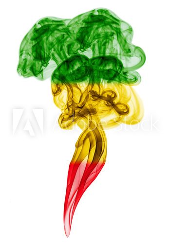Fototapeta Smoke pillar colored in flag of reggae