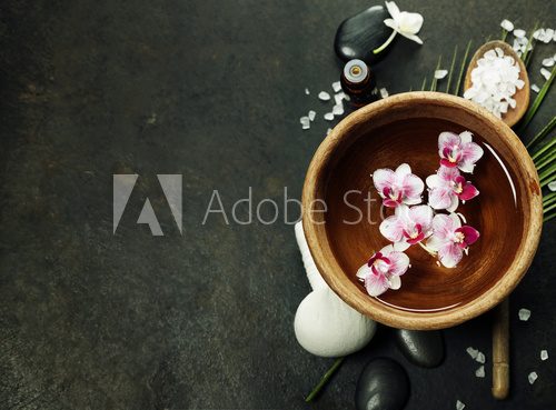 Fototapeta Spa background with floating flowers