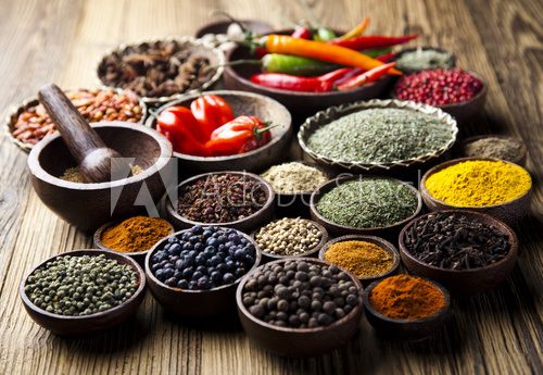 Fototapeta Spices on wooden bowl background 