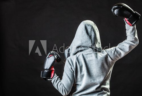 Fototapeta Sport boxer woman in black gloves boxing