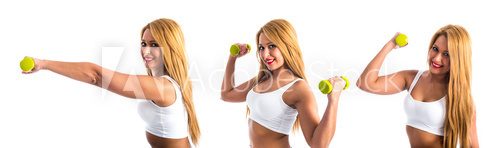 Fototapeta Sport woman doing weightlifting