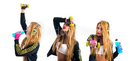 Fototapeta Sport woman holding energy drink and doing weightlifting