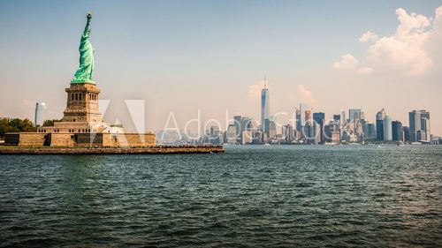 Fototapeta Statue of Liberty and New York skyline on the background