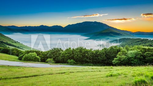 Fototapeta Sunny sunrise in the Castelluccio, Italy, Umbria