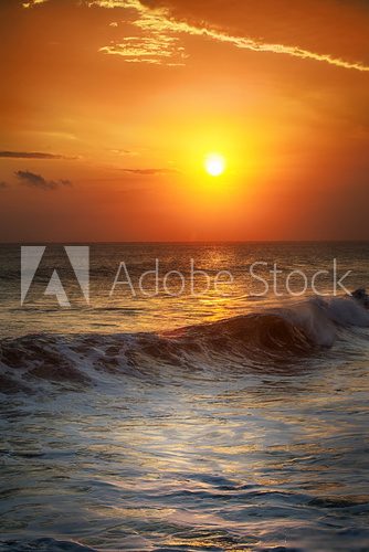 Fototapeta Sunrise in the sea with soft wave and cloudy