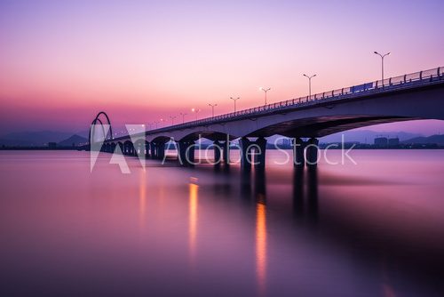 Fototapeta sunrise,sunset skyline and bridge over river