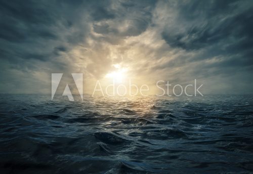 Fototapeta Sunset on stormy sea