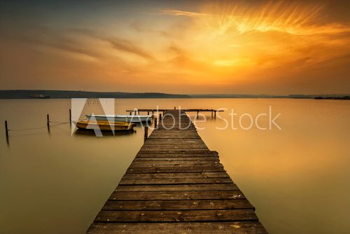 Fototapeta Sunset view with boats at a lake coast near Varna, Bulgaria