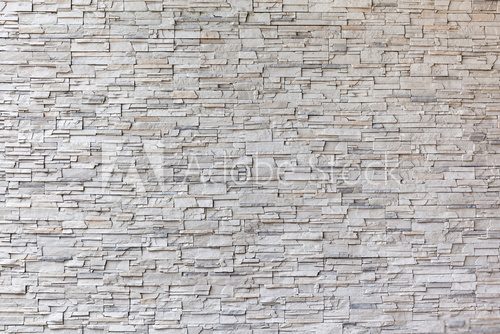Fototapeta The exterior granite brick wall building.