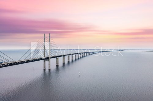 Fototapeta The Oresund bridge between Copenhagen Denmark and Malmo Sweden when sunset in an evening of May