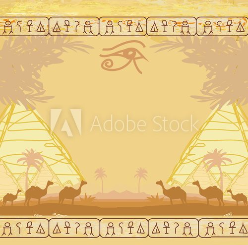 Fototapeta Traditional Horus Eye and camel caravan in wild africa landscape