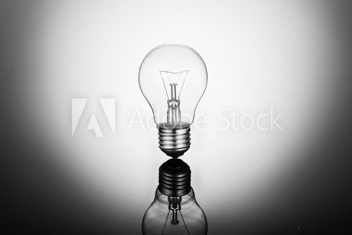 Fototapeta Traditional light bulb on white gradient
