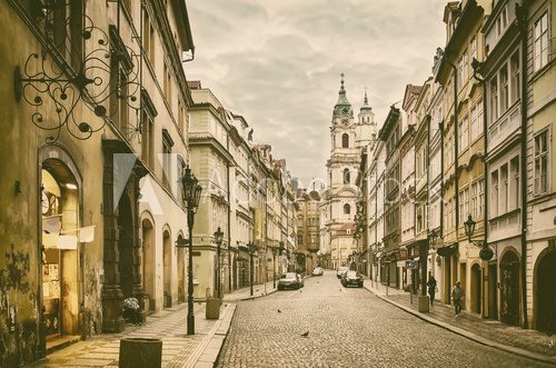 Fototapeta View to the street in the old center of Prague - the capital and largest city of the Czech Republic - vintage sepia retro travel background