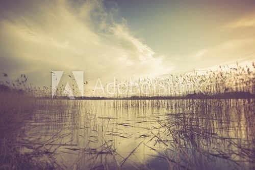 Fototapeta Vintage photo of beautiful sunset over calm lake