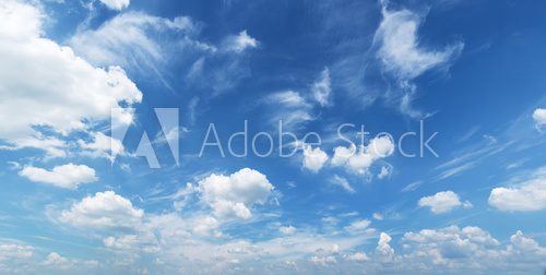 Fototapeta White heap clouds in the blue sky.