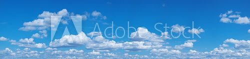 Fototapeta White heap clouds in the blue sky.