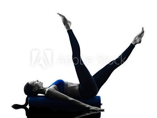 Fototapeta woman pilates roller exercises fitness isolated