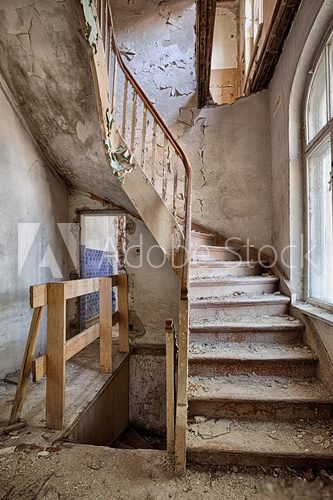 Fototapeta Wooden stairs in an abandoned house