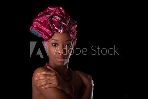 Fototapeta Young beautiful african woman wearing a traditional headscarf, I