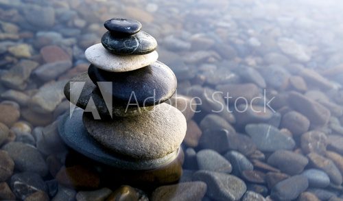 Fototapeta Zen Balancing Rocks on Pebbles Covered with Water